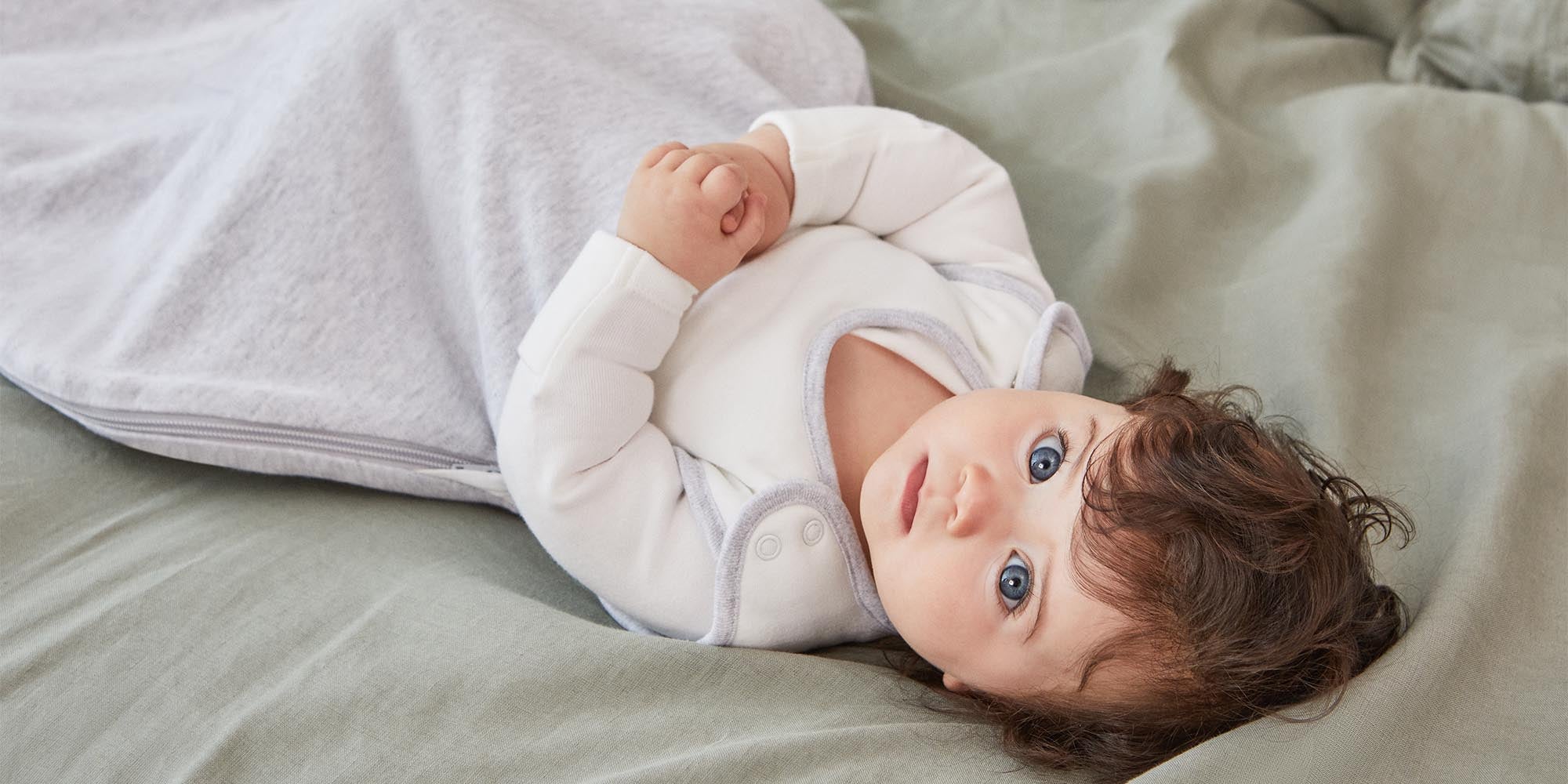 baby in MORI clever sleeping bag - grey