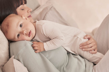 happy baby girl and boy in MORI's clever zip sleepsuits 