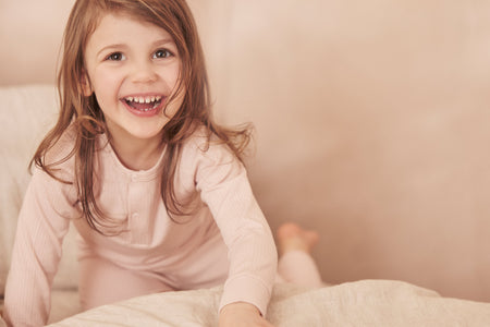 Baby boy and girl wearing MORI's Ribbed Pyjamas - blue & pink