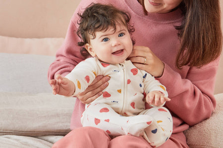 Beautiful baby girl in MORI's Love Heart & Stripe Pyjamas