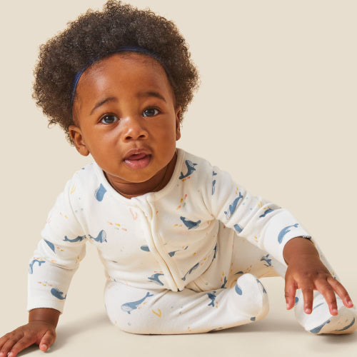 baby in dolphin print organic cotton and bamboo supersoft sleepsuit